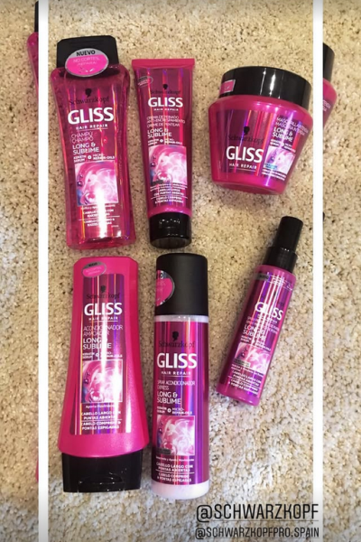 Seis productos Gliss Hair Repair de Schwarzkopf alineados sobre fondo de alfombra clara, incluyendo champú, acondicionador y mascarilla.