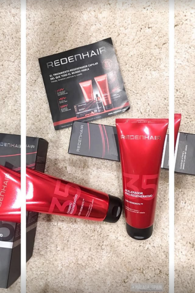 Productos de cuidado capilar Redenhair alineados sobre alfombra clara, con caja y tubo en tonos rojos.